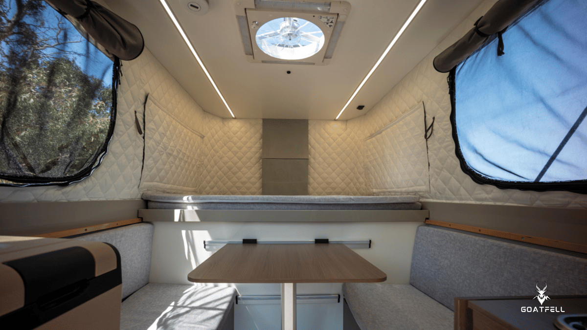 inside table and bed area of demountable camper unit