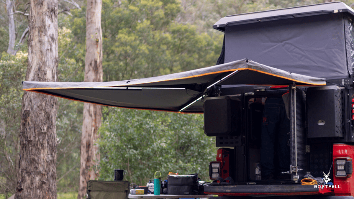 awning of demountable camper truck in the forest 