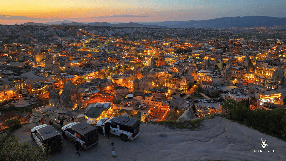 view of demountable camper trucks overlooking a city at dusk