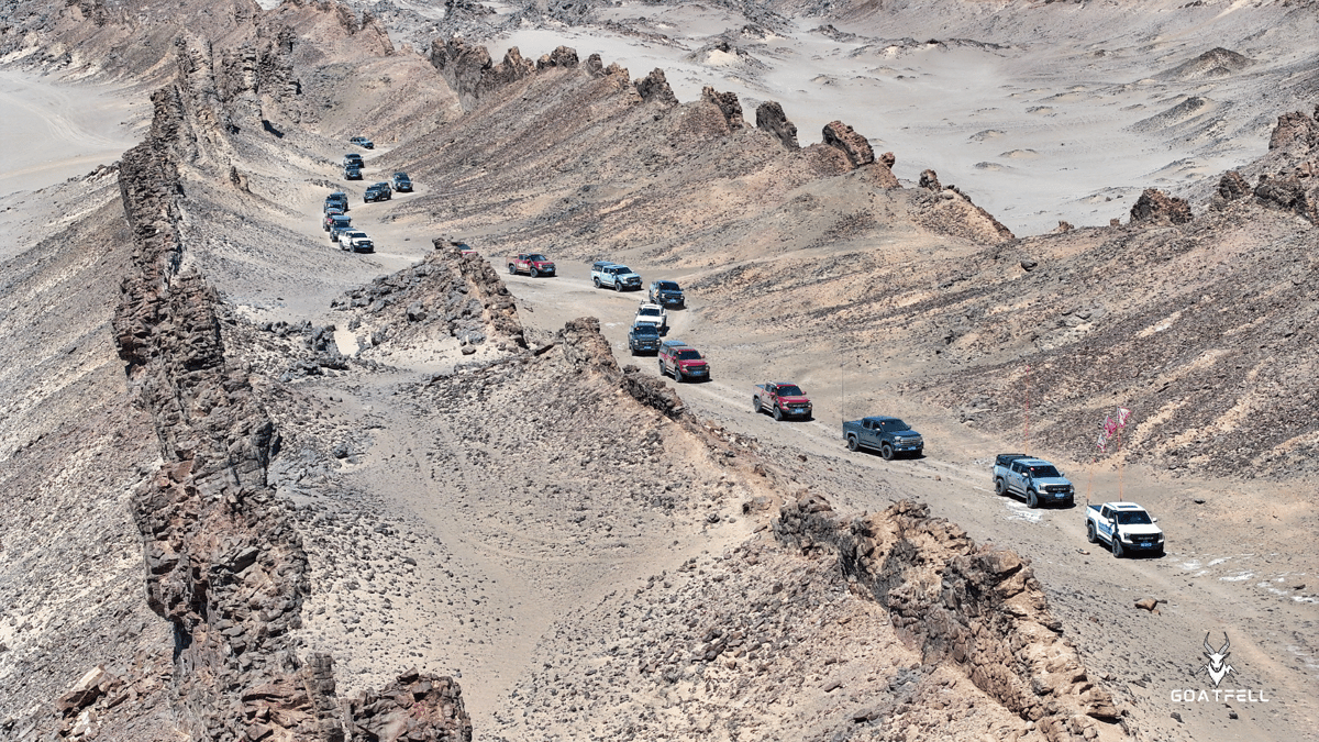 convoy of demountable camper trucks in the desert 