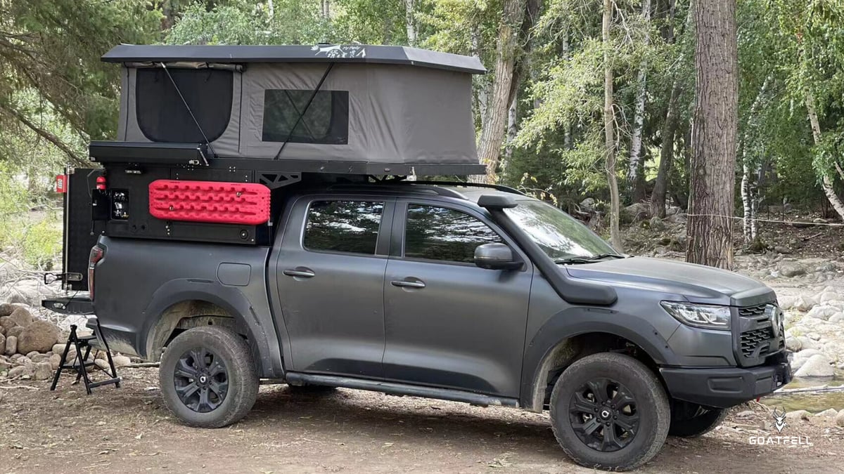 side view of demountable camper unit on pick up truck